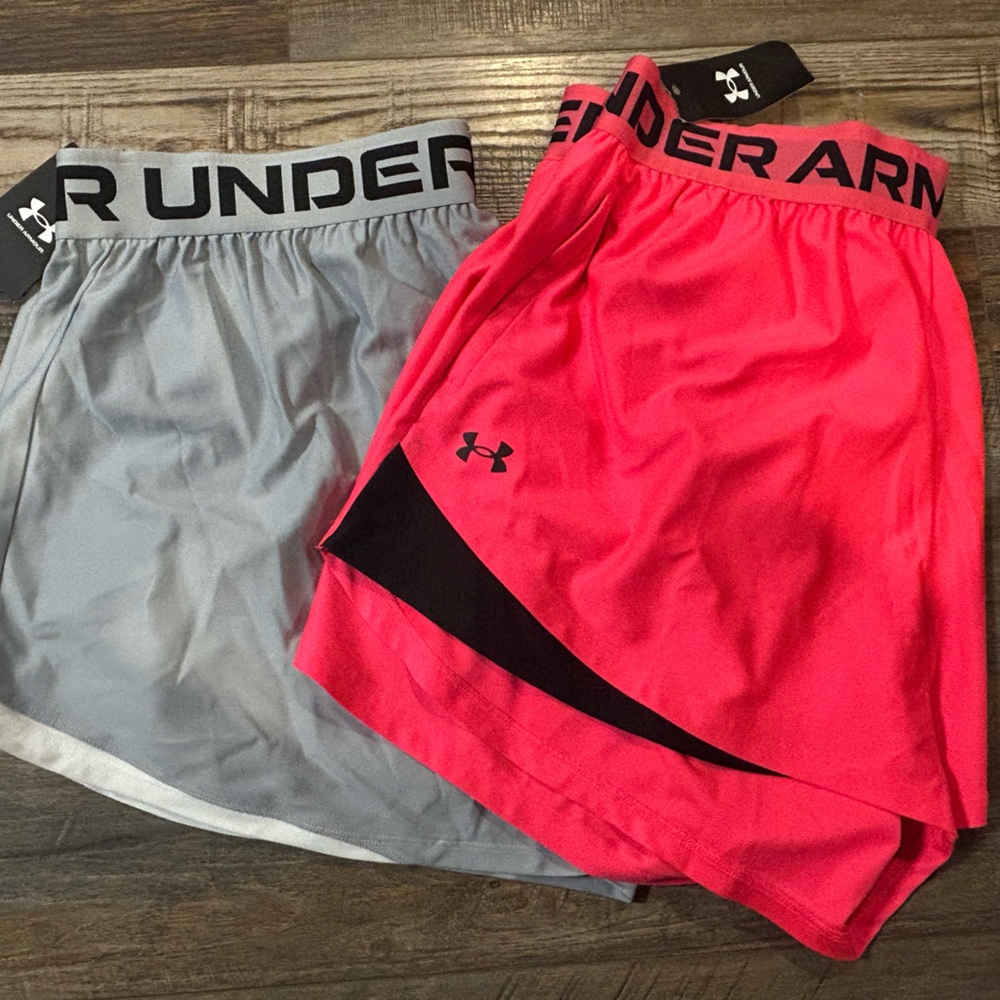2 pair of Under Armour Women’s Light Gray and Pink Athletic Shorts